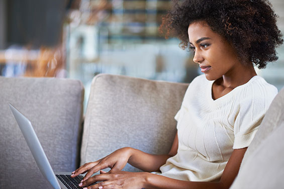 Become Debt Free In 2017 Women Managing Debt On Laptop